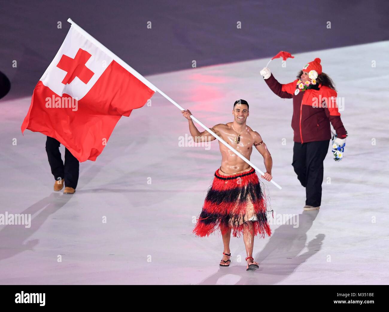 Tonga enter the stadium with their flagbearer Pita Taufatofua. Opening