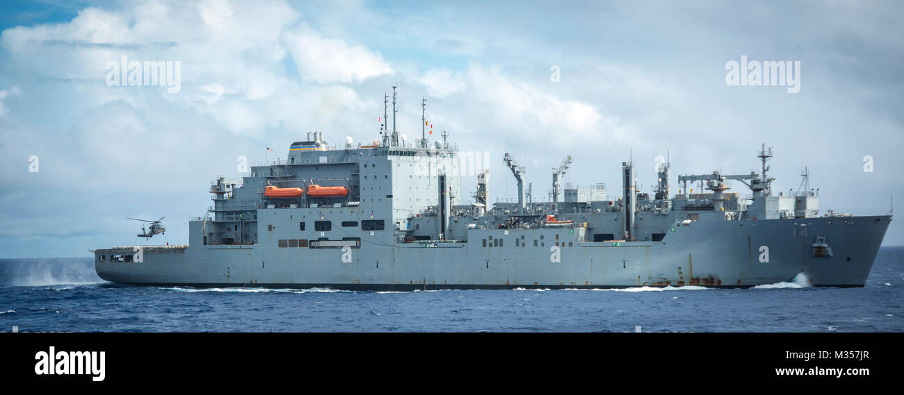 180206-N-CG677-0002  PACIFIC OCEAN (Feb. 6, 2018) The Dry cargo/ ammunition ship USNS Cesar Chavez (T-AKE 14) performs a vertical replenishment-at-sea with the Nimitz-class aircraft carrier USS Carl Vinson (CVN 70). Carl Vinson Strike Group is currently operating in the Pacific as part of a regularly scheduled deployment. (U.S. Navy photo by Mass Communication Specialist 3rd Class Jake Cannady/Released) Stock Photo