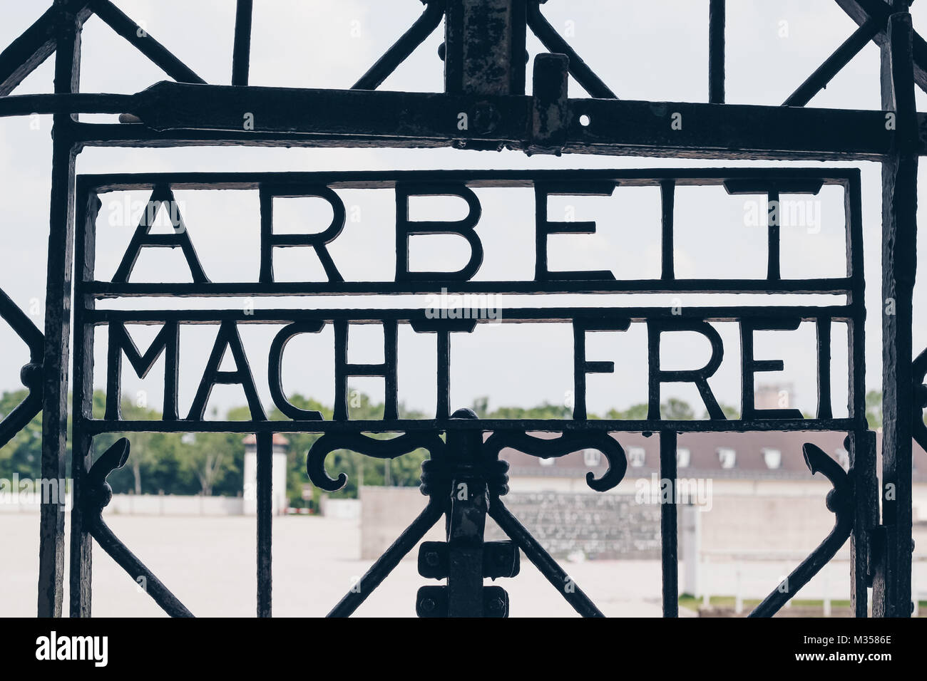 DACHAU, GERMANY - July 6, 2016 ; The Main gate of concentration camp with the sign ARBEIT MACHT FREI - Holocaust Memorial Museum. Stock Photo
