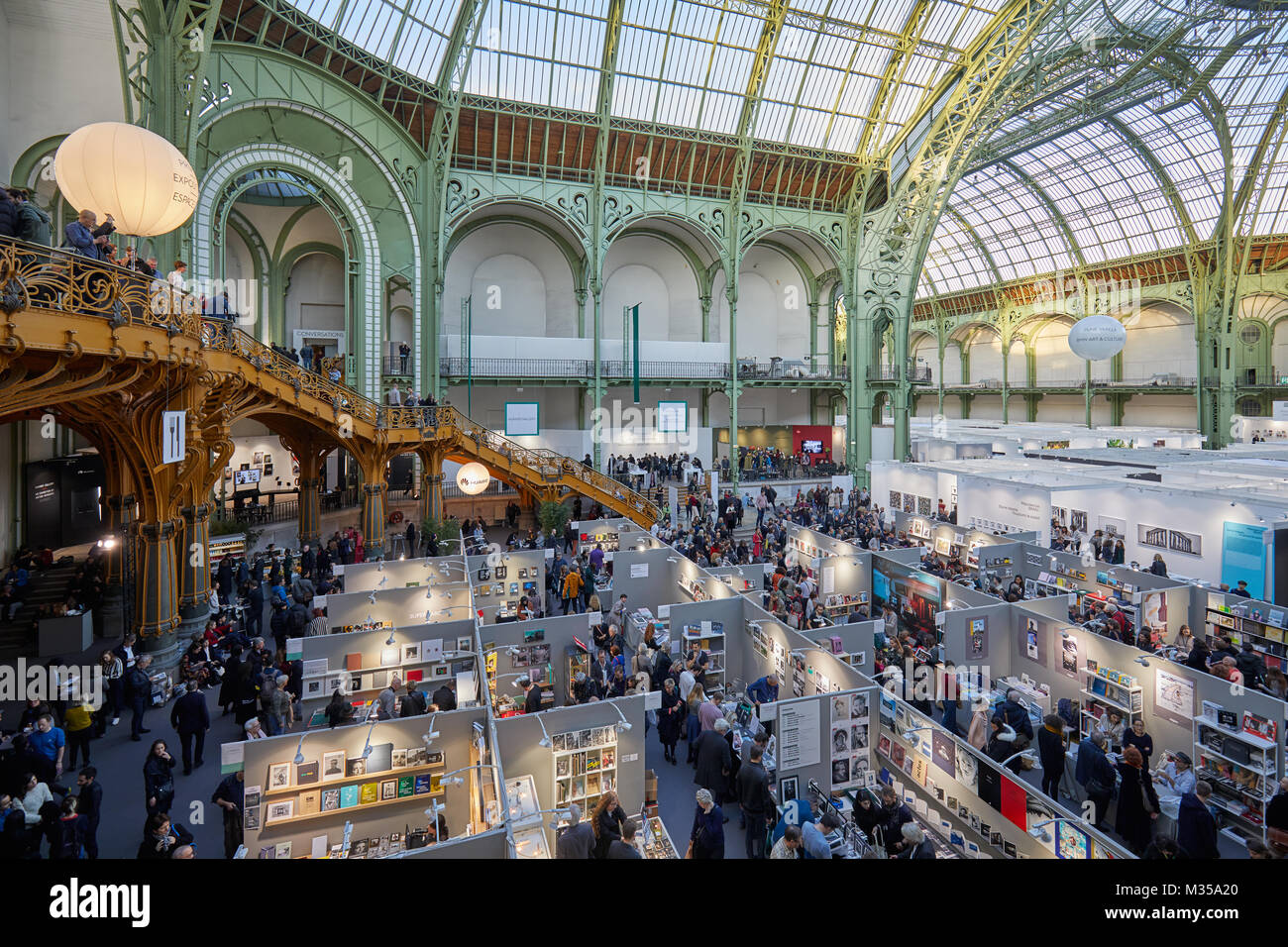 PARIS - NOVEMBER 10: Paris Photo art fair high angle view with people, terrace and bookshop area at Grand Palais on November 10, 2017 in Paris, France Stock Photo