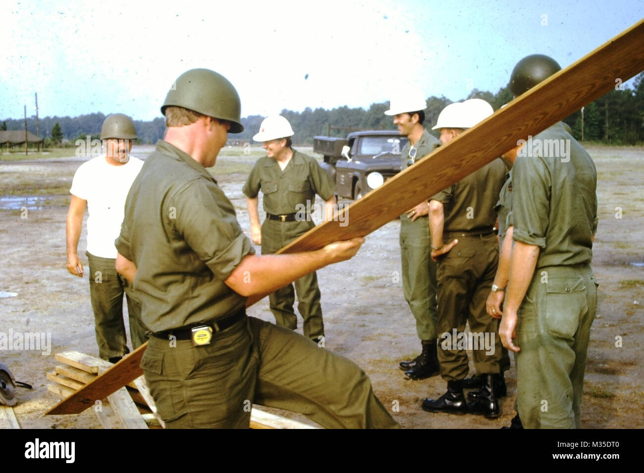 FORT STEWART, Ga. July 1973 - Georgia Governor Jimmy Carter visits Georgia Guardsman during annual training at Fort Stewart. Governor Carter and Guard Engineers by Georgia National Guard Stock Photo