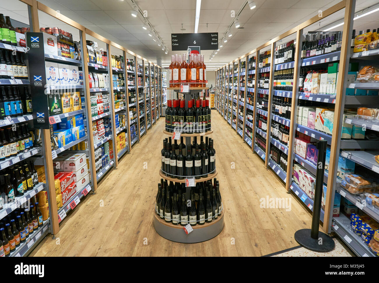 Alcohol aisle in a local Cooperative store in Glasgow, Scotland, UK Stock Photo