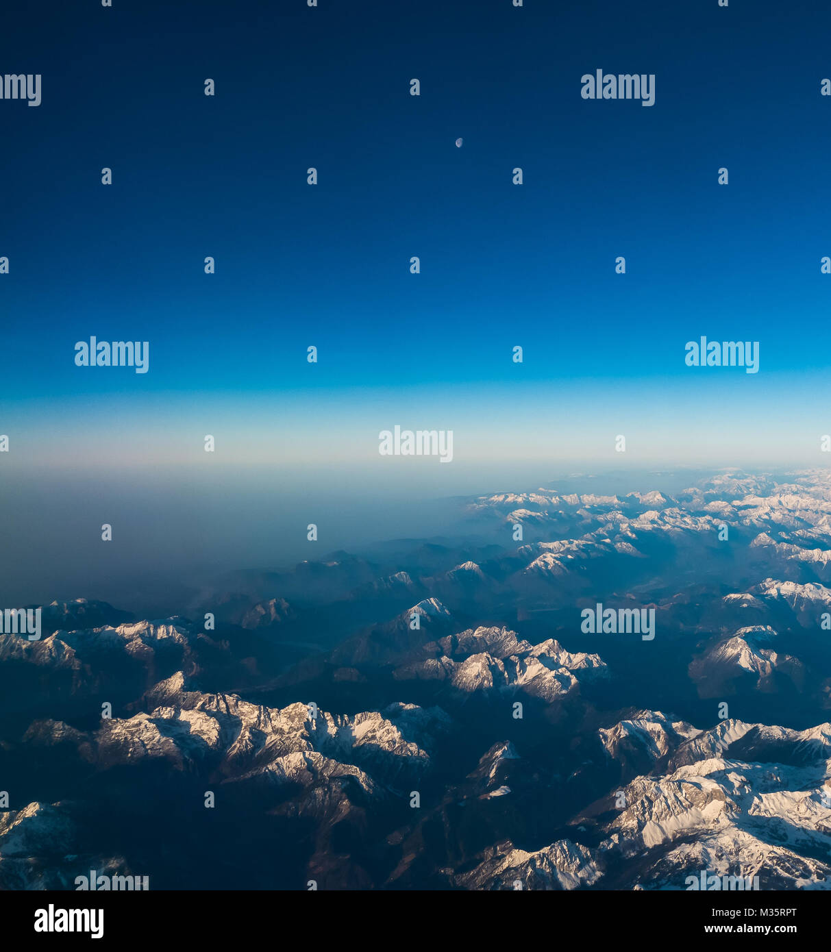 Looking through the window aircraft during flight a snow covered ...