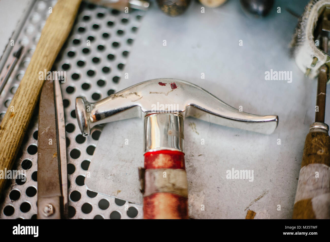 interior repair shop and shoe making, tools to repair shoes hammer pliers  Stock Photo - Alamy