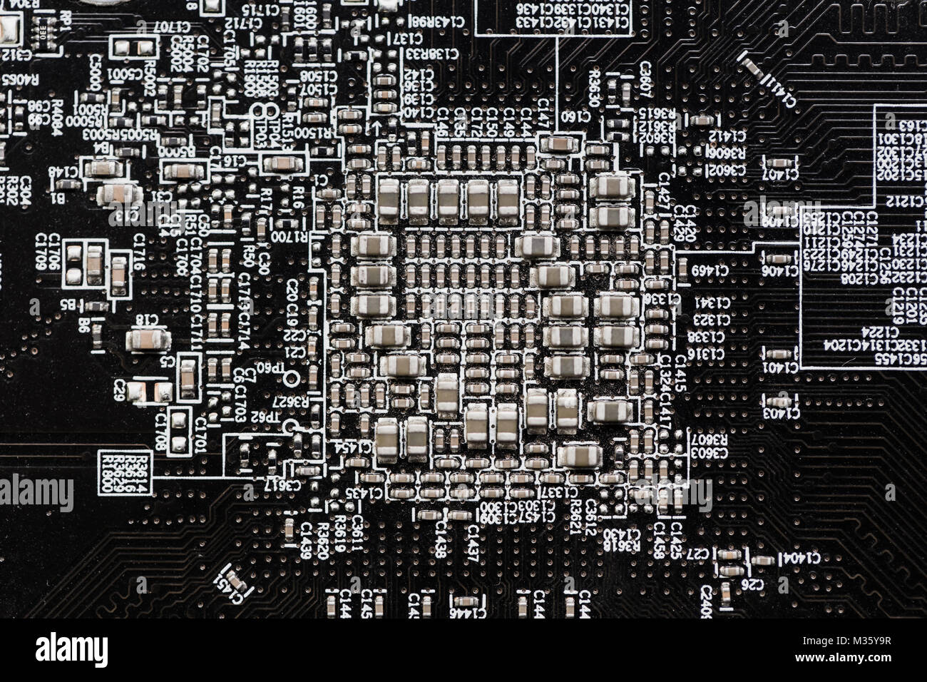 Ceramic Capacitors at Digital electronic circuit board closeup very