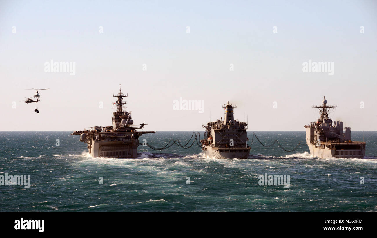 150719-N-TW634-092 INDIAN OCEAN (July 19, 2015) The amphibious dock landing ship USS Ashland (LSD 48), right, the Military Sealift Command underway replenishment oiler USNS Tippecanoe (T-AO-199), and the amphibious assault ship USS Bonhomme Richard (LHD 6), engage in a replenishment-at-sea. Ashland and Bonhomme Richard are assigned to the Bonhomme Richard Expeditionary Strike Group and are on patrol in the U.S. 7th Fleet area of operations. (U.S. Navy photo by Mass Communication Specialist 3rd Class Derek A. Harkins/Released) USS Bonhomme Richard, USNS Tippecanoe and USS Ashland Conduct Replen Stock Photo