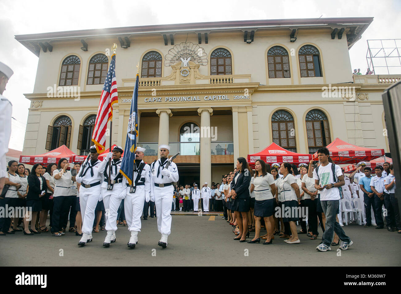 ROXAS CITY, Philippines (July 20, 2015) The color guard from the hospital ship USNS Mercy (T-AH 19) parades the colors during a ceremony in Roxas City, Philippines, as part of Pacific Partnership 2015. Mercy is currently in the Philippines for its third mission port of PP15. Pacific Partnership is in its 10th iteration and is the largest annual multilateral humanitarian assistance and disaster relief preparedness mission conducted in the Indo-Asia-Pacific region. While training for crisis conditions, Pacific Partnership missions to date have provided real world medical care to approximately 27 Stock Photo