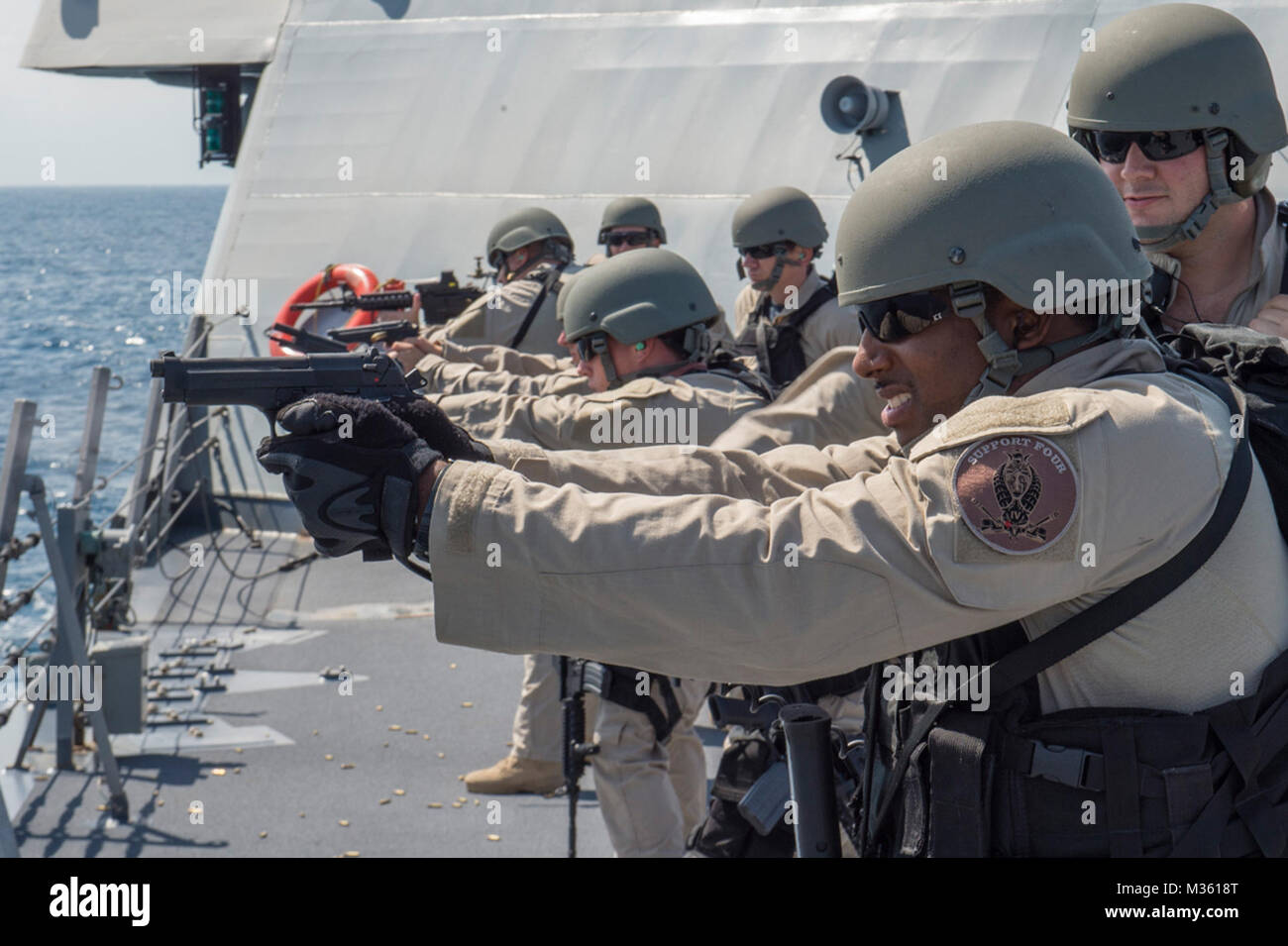 150801-N-MK881-245 SOUTH CHINA SEA (August 1, 2015) Sailors assigned to Surface Warfare Mission Package, Detachment 4, currently embarked aboard the littoral combat ship USS Fort Worth (LCS 3) participate in a live fire exercise on the ship’s forecastle. Currently on a 16-month rotational deployment in support of the Indo-Asia-Pacific Rebalance, Fort Worth is a fast and agile warship tailor-made to patrol the region’s littorals and work hull-to-hull with partner navies, providing 7th Fleet with the flexible capabilities it needs now and in the future. (U.S. Navy photo by Mass Communication Spe Stock Photo