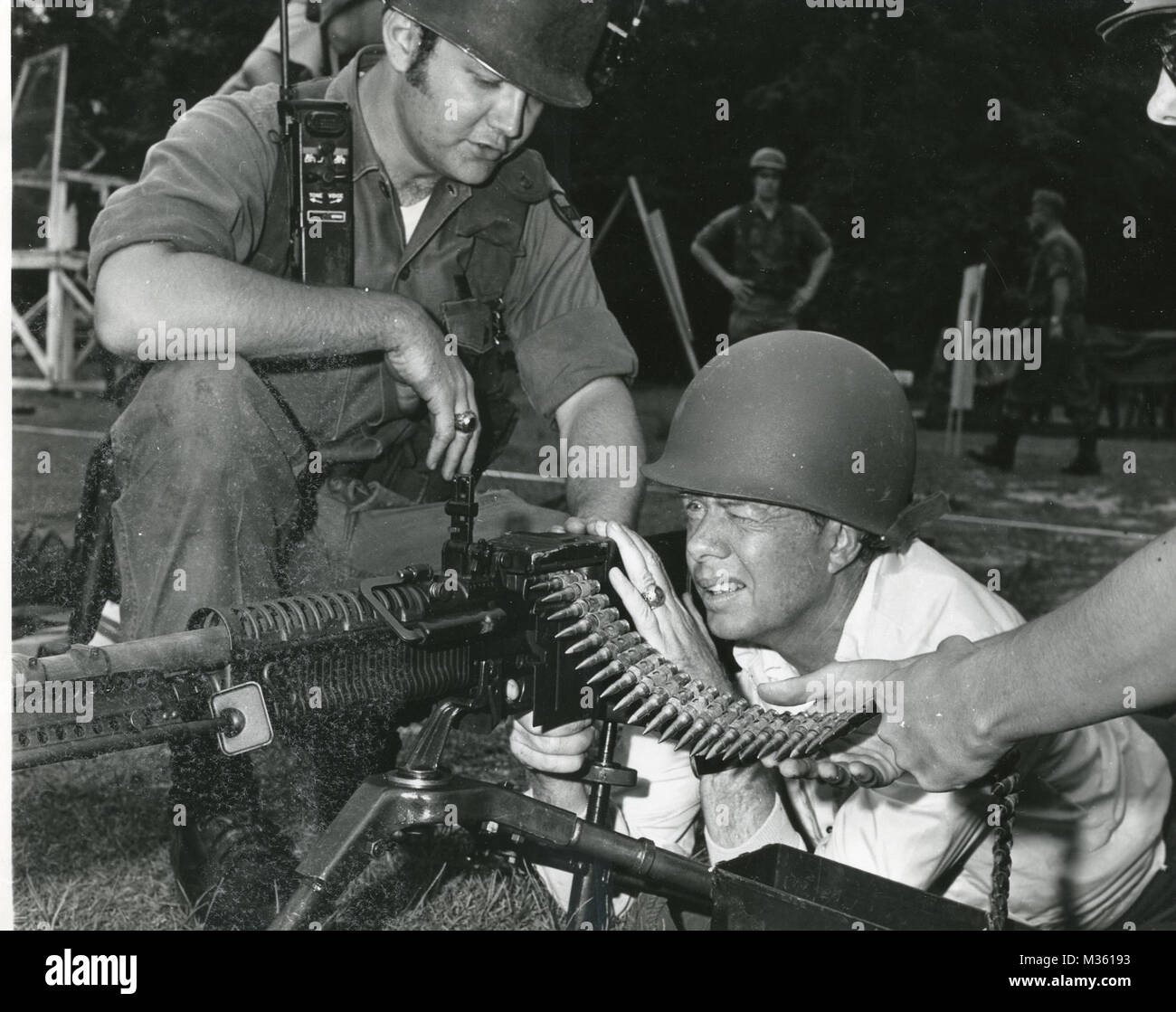 FORT STEWART, Ga. June 7, 1972- Governor Jimmy Carter prepares to fire an M60 machine gun during a visit to Georgia Army National Guard troops undergoing annual training at Fort Stewart.  The Governor and First Lady observed a firing demonstration by the 1st Battalion 121st Infantry then got to fire the weapons themselves. Governor Carter on M-60 by Georgia National Guard Stock Photo