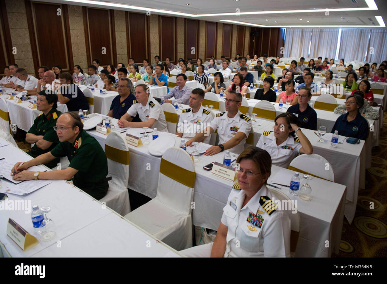 Crew members from the hospital ship USNS Mercy (T-AH 19) and Vietnamese medical personnel participate in a restorative medicine summit at the Da Nang Northern Hotel during Pacific Partnership 2015. Topics covered included burn reconstruction, hair restoration, orthopedic injury treatment, polytrauma and rehabilitation, physical therapy, and occupational therapy. Mercy is currently in Vietnam for its fourth mission port of Pacific Partnership. PP15 is in its 10th iteration and is the largest annual multilateral humanitarian assistance and disaster relief preparedness mission conducted in the In Stock Photo