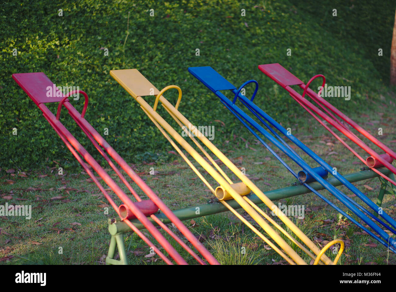 Four colorful seesaws at a playground. Stock Photo