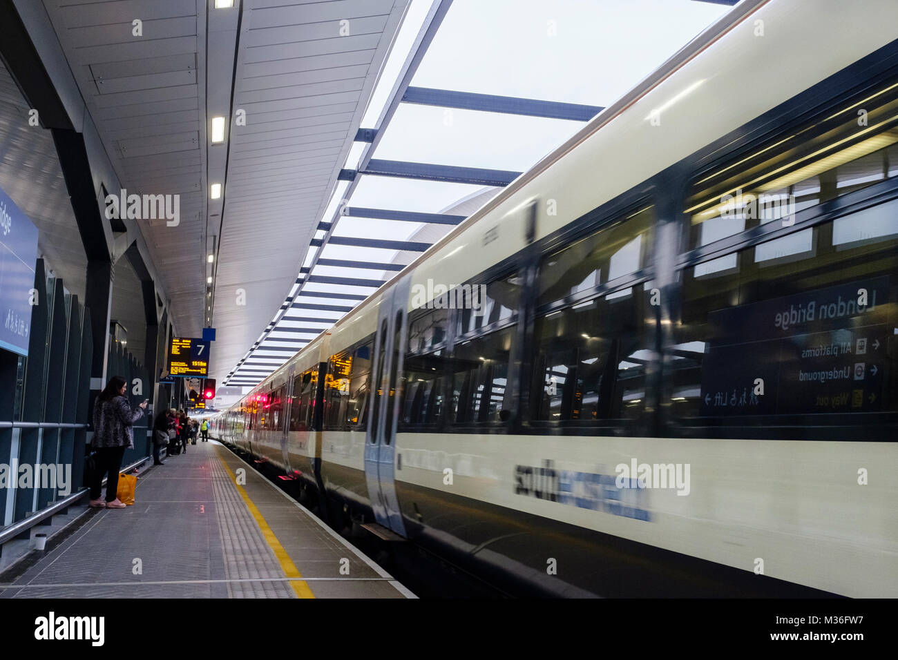 A Southeastern train passing through London Bridge station, London, UK Stock Photo