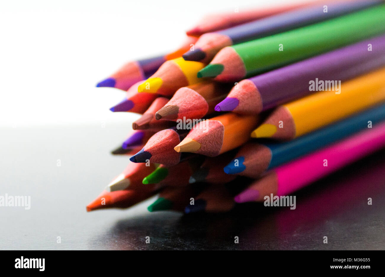 Pattern of color pencils isolated on Black background close up Stock Photo