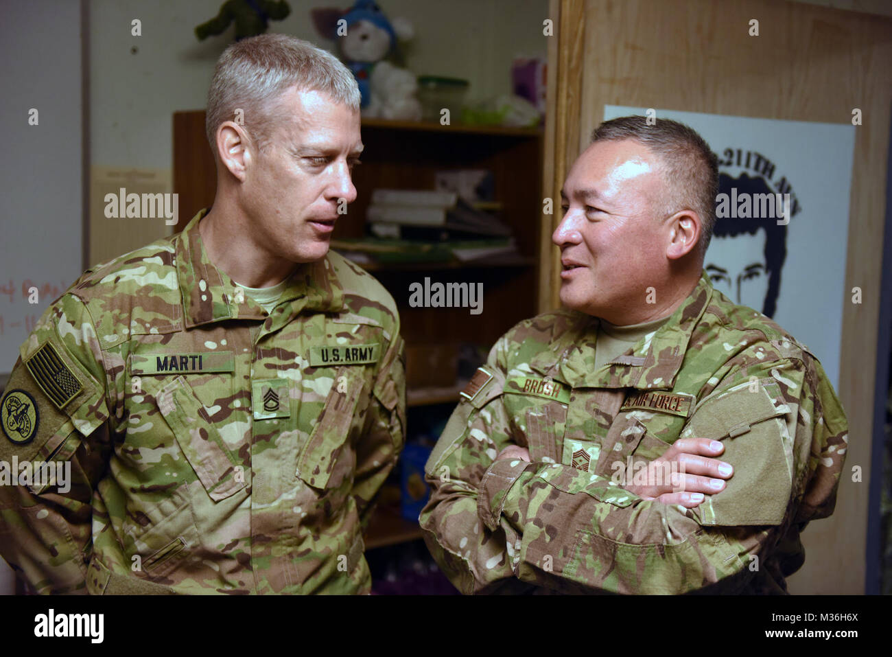 Air Force Chief Master Sgt. Mitchell Brush, right, senior enlisted advisor to the chief of the National Guard Bureau, during a Thanksgiving Day troop visit, Bagram Airfield, Bagram, Afghanistan, Nov. 24, 2016. (U.S. Army National Guard photo by Sgt. 1st Class Jim Greenhill) 161124-Z-DZ751-240 by Texas Military Department Stock Photo