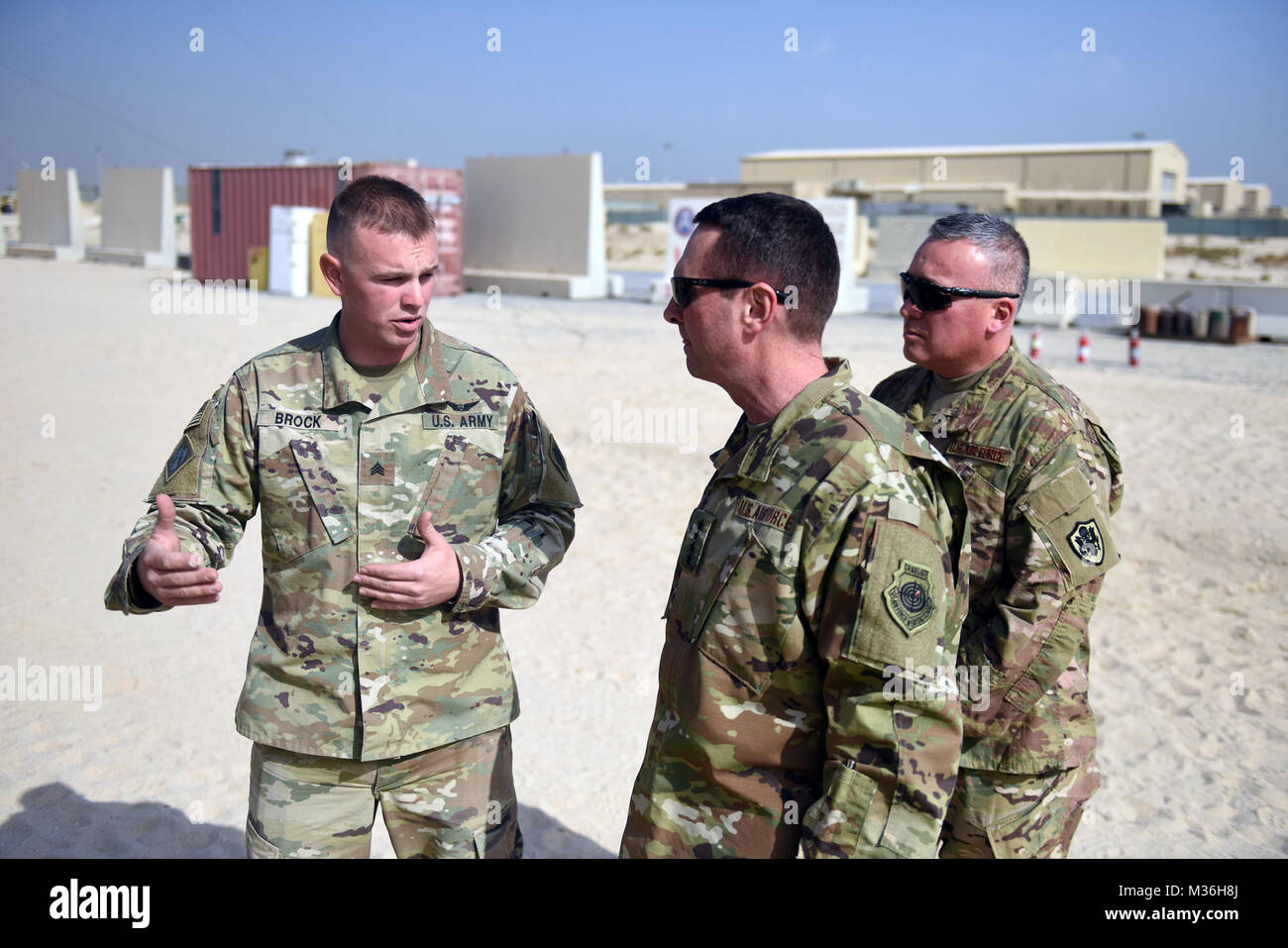 Air Force Gen. Joseph Lengyel, chief, National Guard Bureau, center, and Air Force Chief Master Sgt. Mitchell Brush, senior enlisted advisor to the chief of the National Guard Bureau, right, receive a briefing during a Thanksgiving visit with troops serving in Kuwait, Nov. 25, 2016. (U.S. Army National Guard photo by Sgt. 1st Class Jim Greenhill) 161125-Z-DZ751-294 by Texas Military Department Stock Photo