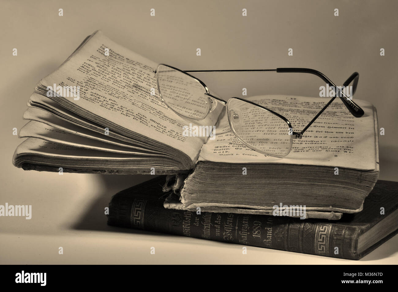 old-books-to-read-with-glasses-stack-of-books-information-and-know