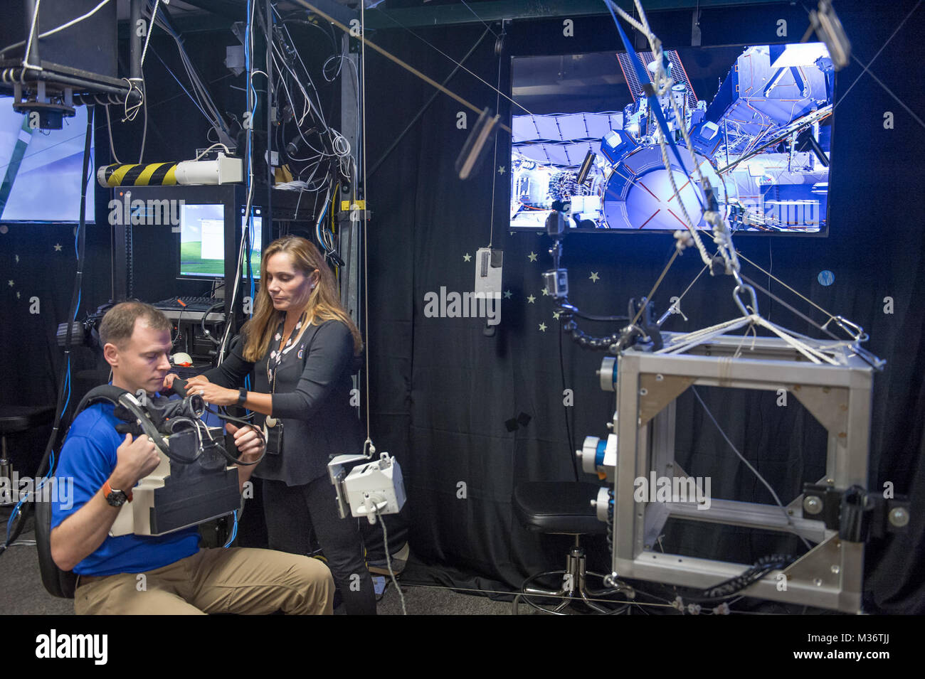 NASA Virtual Reality Lab technician, Evelyn Miralles, prepares