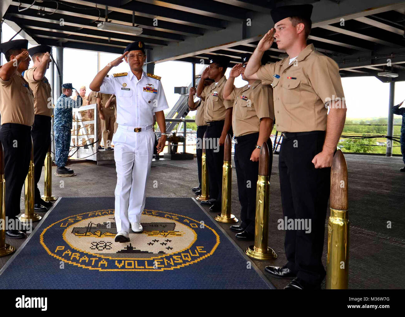 151201-N-RN782-012:  POLARIS POINT, Guam (Dec. 1, 2015) Side boys assigned to the submarine tender USS Frank Cable (AS 40) salute as Royal Malaysian Navy Rear Adm. Datuk Abdul Rahman Bin HJ. Ayob, commander, Submarine Force, comes aboard for a visit to the ship, Dec. 1.  Rahman visited Frank Cable for a luncheon hosted by Commander, Submarine Group Seven, Rear Adm. William Merz.  The luncheon was just one of a series of events scheduled as part of submarine staff talks between Malaysia and the United States.  Frank Cable, forward deployed to the island of Guam, conducts maintenance and support Stock Photo