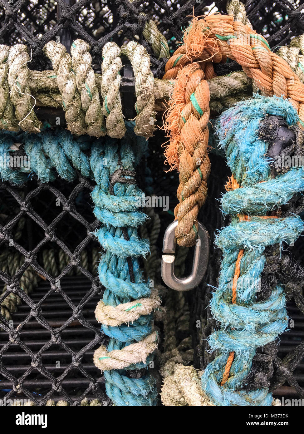 Fishing pots piled on the dock Stock Photo