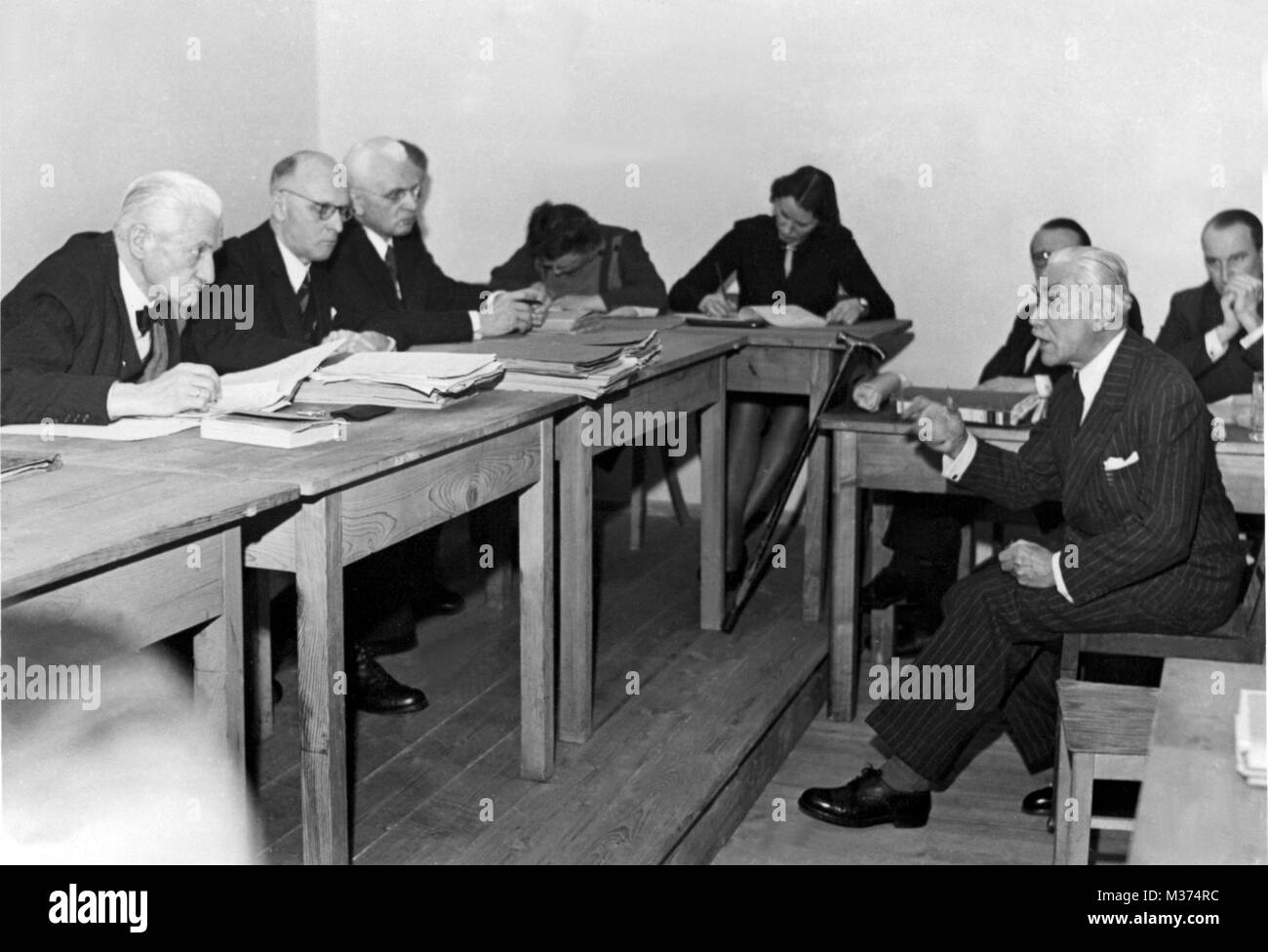 The former Reich Chancellor (1932) Franz von Papen (right) at the beginning of the hearing of an appeal in the 'Berufungskammer' (translated as 'chamber of appeal') of Nuremberg on 18 January 1949. On 26 January 1949, the final - reduced - sentence was announced. After a military career, von Papen made a political career as a member of the 'Zentrumspartei' (translated as 'German Centre Party'). Although he often represented the opposite point of view, he represented the party in the Prussian federal state parliament from 1920-1928 and 1930-1932. From May (leaving the party) until November 1932 Stock Photo