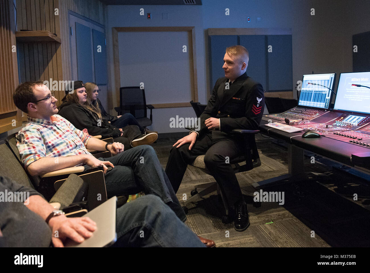 ATHENS, Ohio (April 6, 2017) Musician 1st Class Steven Van Dyne talks to audio students during a masterclassat the University of Ohio in Athens, Ohio. The U.S. Navy Band performed in nine states during its 23-city national tour, connecting the Navy to communities that don't see Sailors at work on a regular basis. (U.S. Navy photo by Chief Musician Adam Grimm/Released) Navy Band visits Athens by United States Navy Band Stock Photo