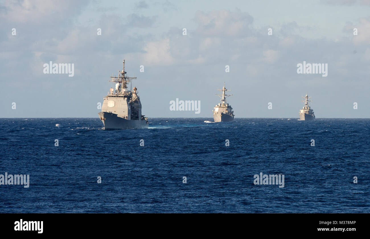 170710-N-JS726-104 CORAL SEA – (From left to right) The Ticonderoga-class guided-missile cruiser USS Shiloh (CG 67) along with the Arleigh Burke-class guided-missile destroyers USS McCampbell (DDG 85) and USS Barry (DDG 52) conduct maneuvers during Talisman Saber 2017. Talisman Saber is a realistic and challenging exercise that brings service members closer and improves both U.S. and Australia’s ability to work bilaterally and multilaterally, while preparing them to be poised to provide security both regionally and globally. (U.S. Navy photo by Mass Communication Specialist 1st Class David Hol Stock Photo