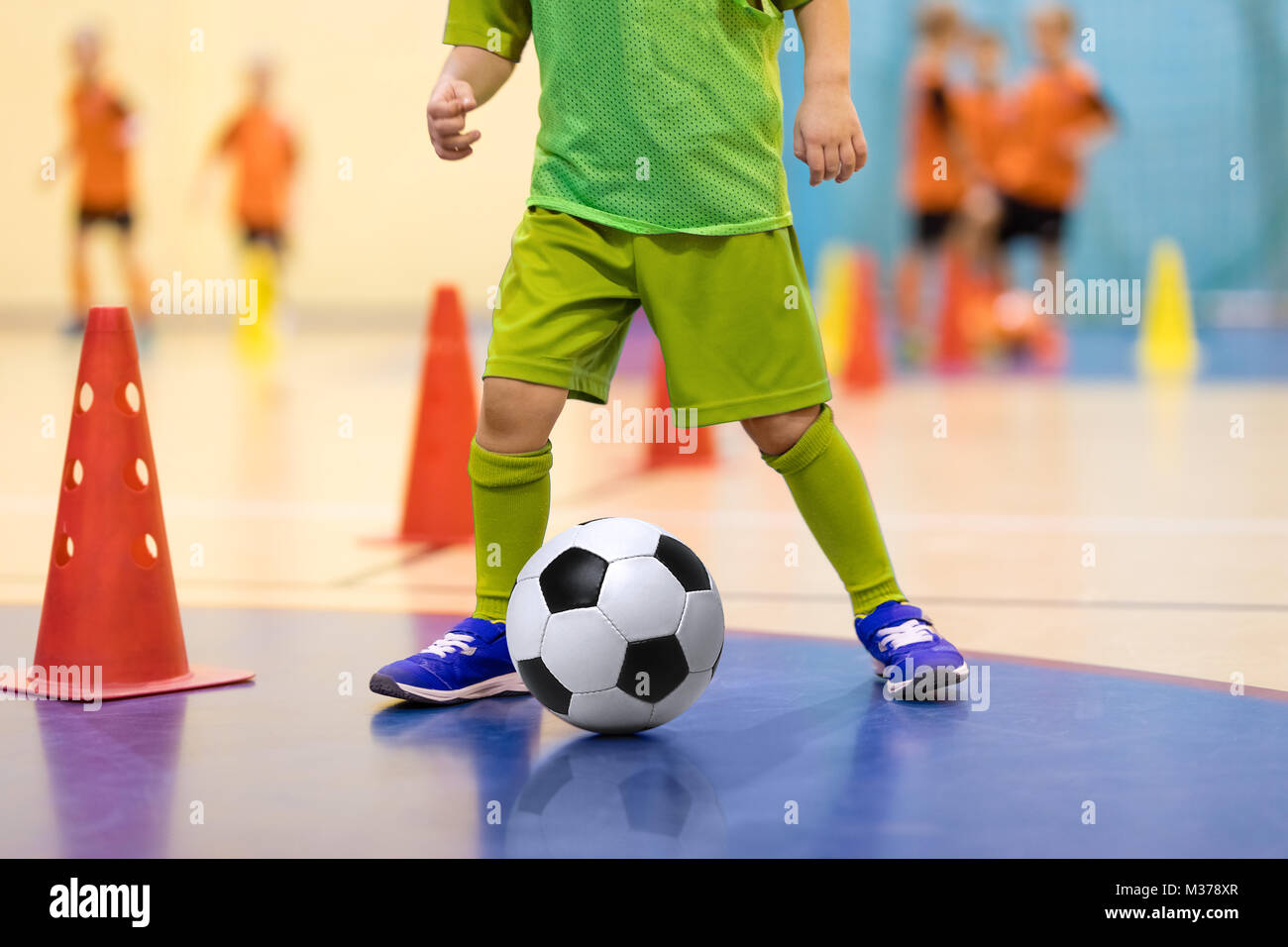 Football futsal training for children. Soccer training dribbling cone