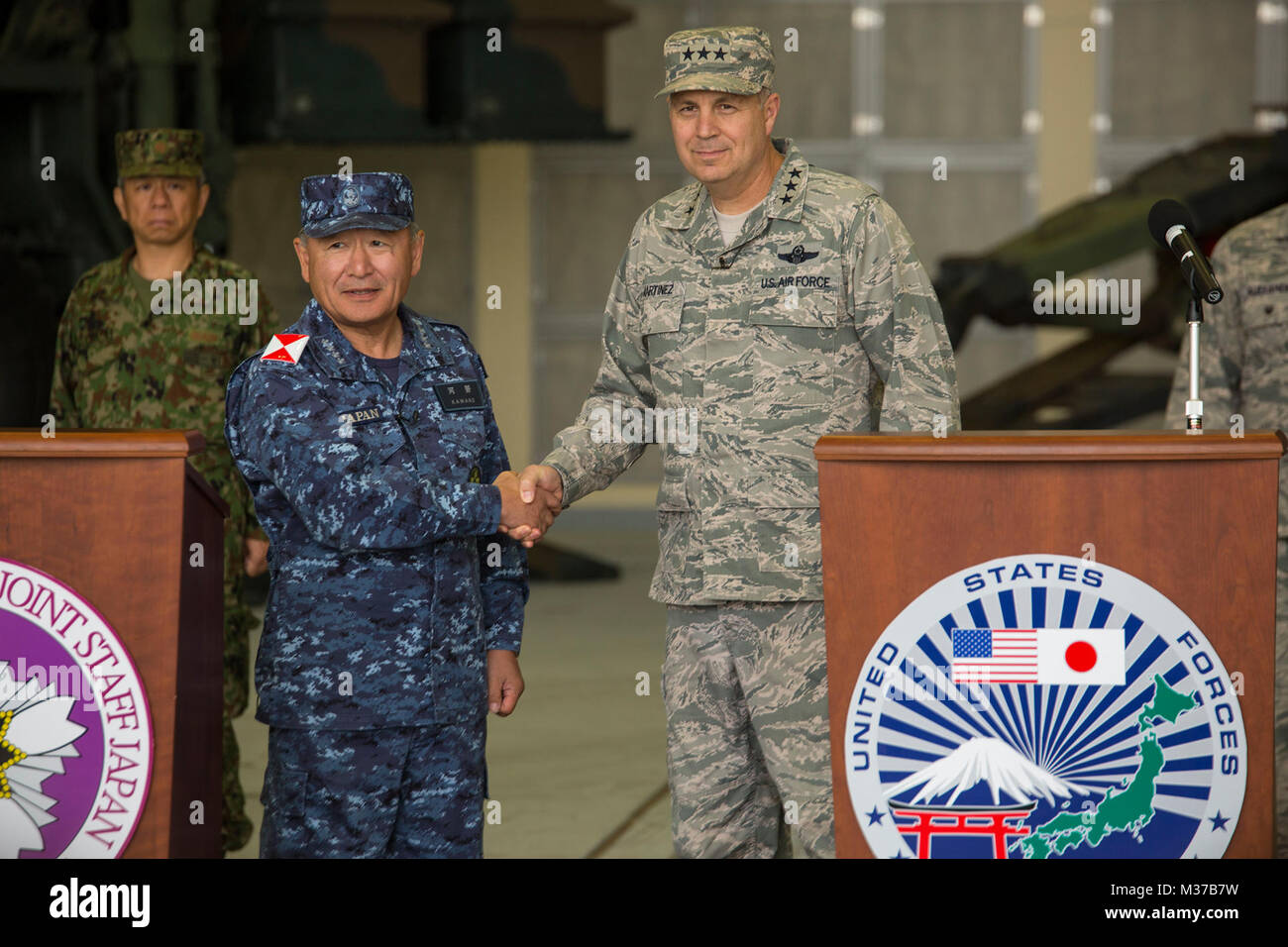 U.S. Air Force Lt. Gen. Jerry P. Martinez, commander of U.S. Forces Japan and 5th Air Force, Pacific Air Forces, and Admiral Katsutoshi Kawano, Chief of Staff of the Japan Joint Staff, held a press conference at the conclusion of Keen Sword 2017 at Marine Corps Air Station Iwakuni, Japan, Nov. 10, 2016. Held since 1986, Keen Sword is the largest joint, bilateral field training exercise between the U.S. military and Japan Self-Defense Force. The forces conducted air and amphibious training at military installations throughout mainland Japan, Okinawa and in air and sea surrounding Japan, Guam an Stock Photo