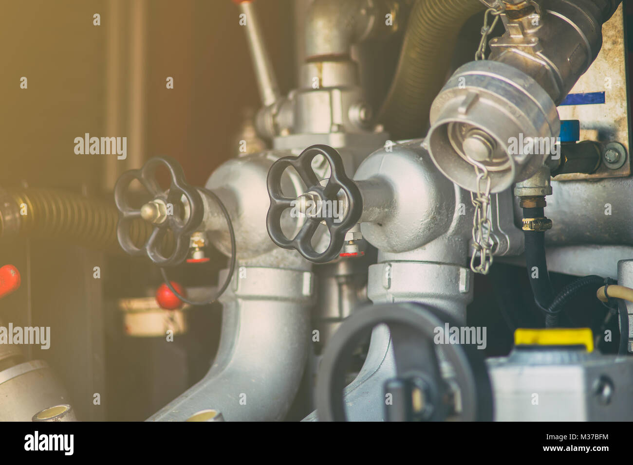 closeup valve water pump and pipe pressure control water in and out of