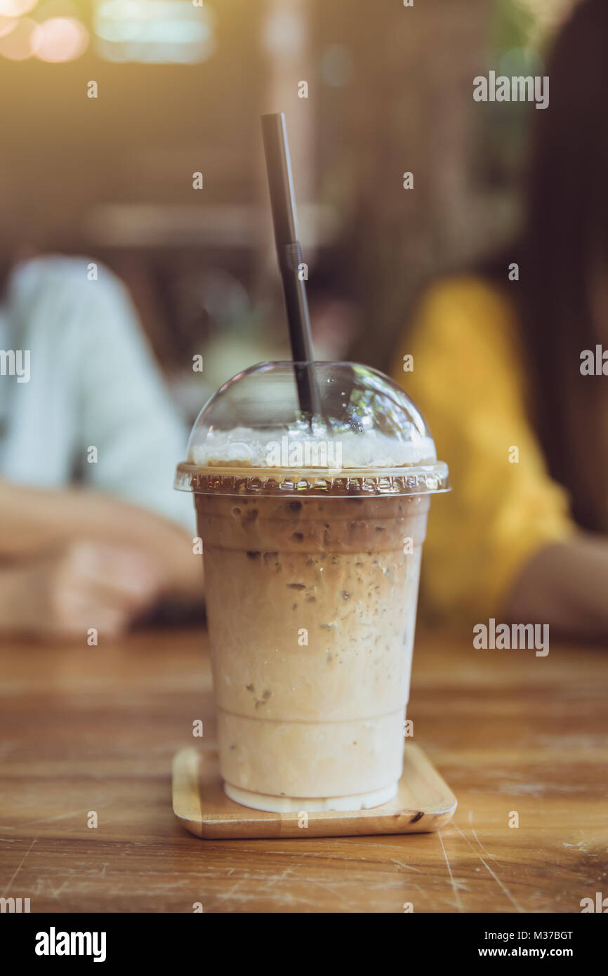 iced milk coffee on wood table chill drink in summer season Stock Photo