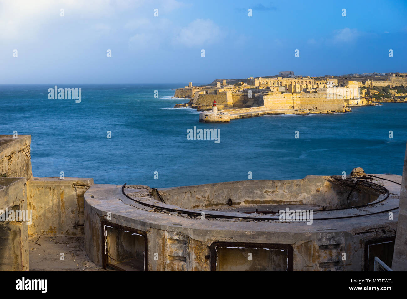 Malta. Fort Ricasoli and Breakwater with the lighthouse viewed from the walls of Fort Saint Elmo, Grand Harbour Stock Photo