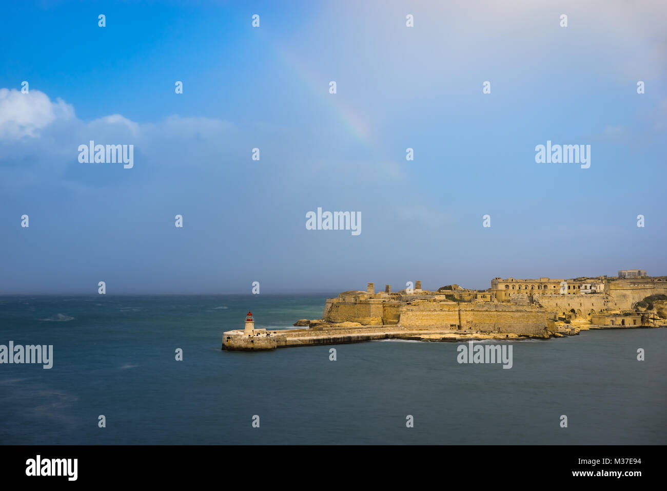 Fort Ricasoli and Breakwater with the lighthouse, Grand Harbour, Malta Stock Photo