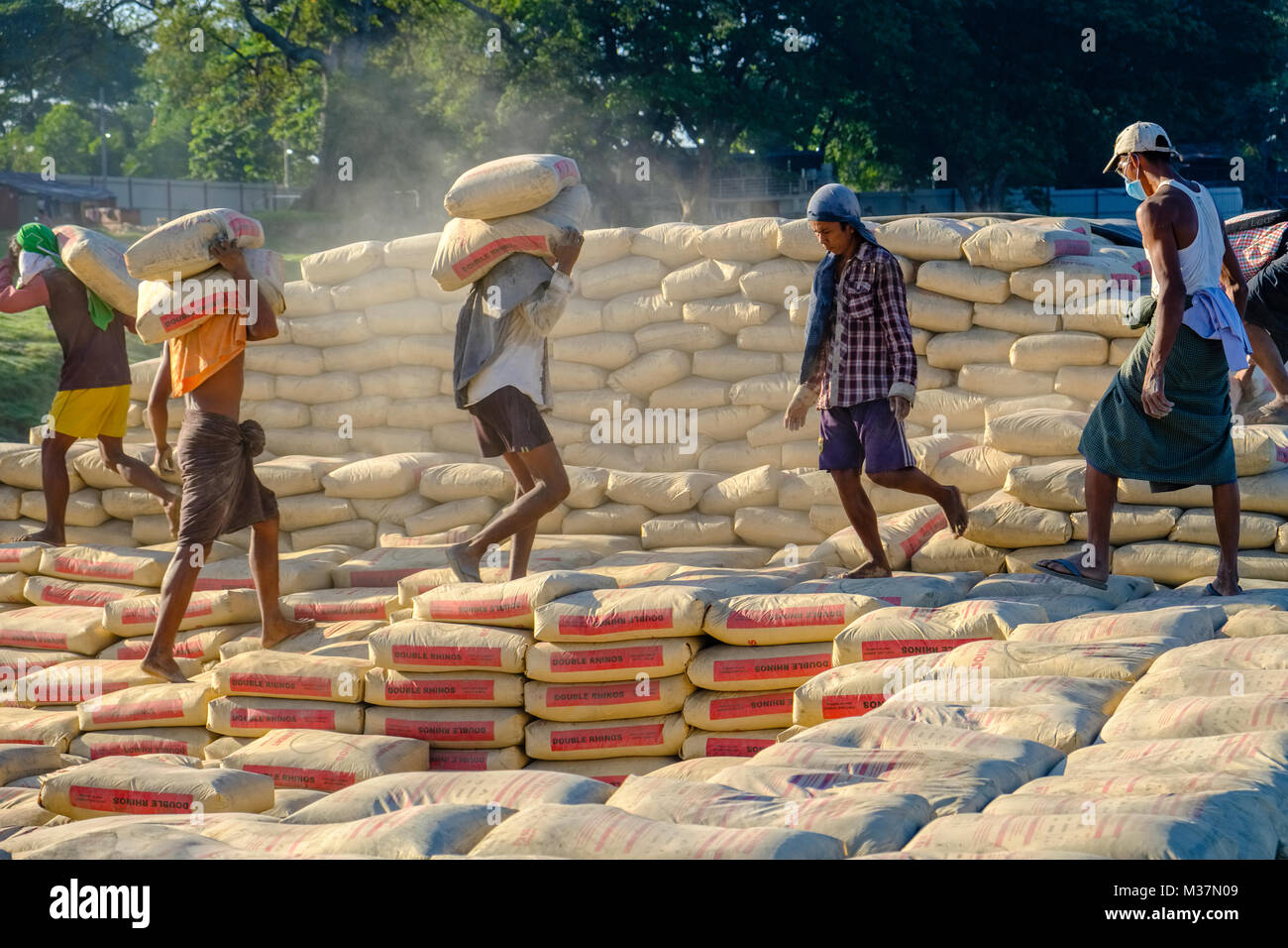 Worker Using Cement Bag