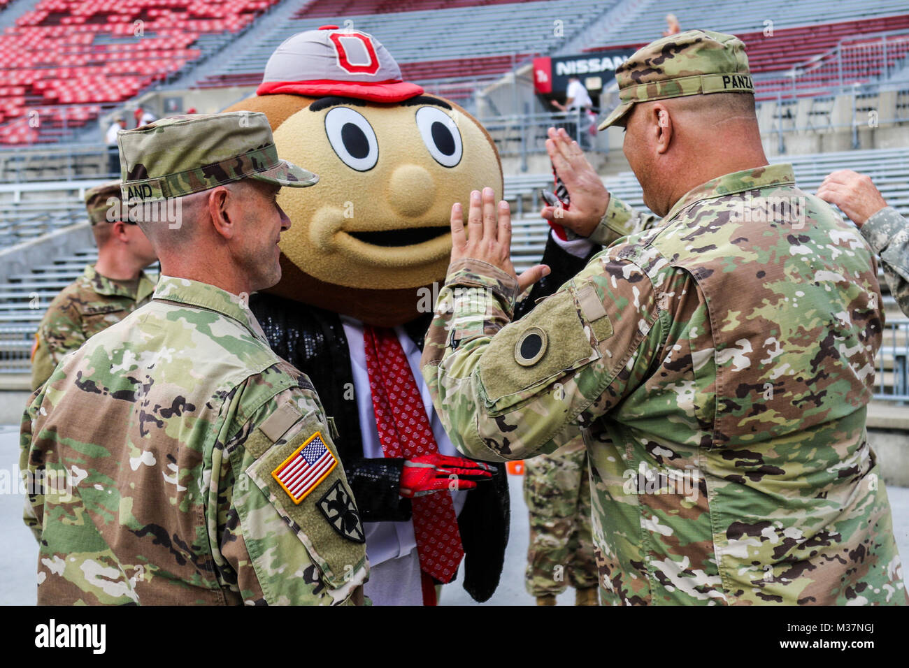Brutus Buckeye, the mascot of The Ohio State University, greets members ...