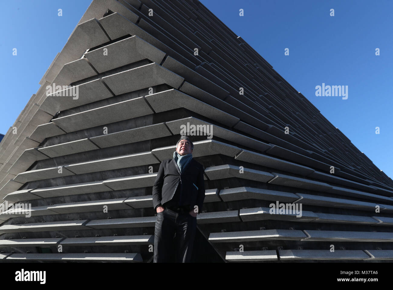 Japanese architect Kengo Kuma as he views the finished exterior of the new eighty million pound V&A Dundee museum for the first time. The designer met workers as the focus moves to the interior of the V&A, fitting out gallery spaces, a cafe and a restaurant ahead of its opening in September. Stock Photo