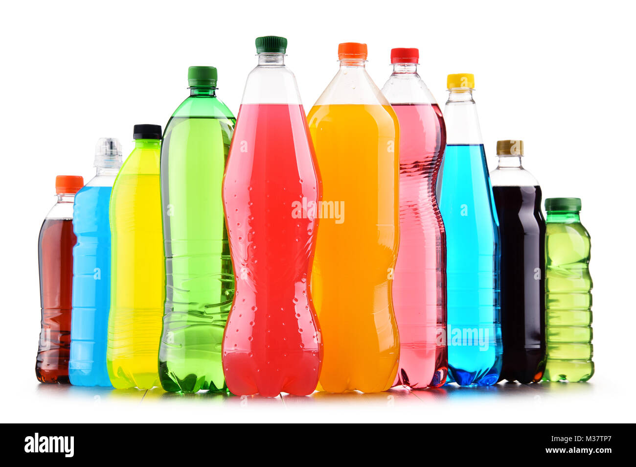 Plastic bottles of assorted carbonated soft drinks over white