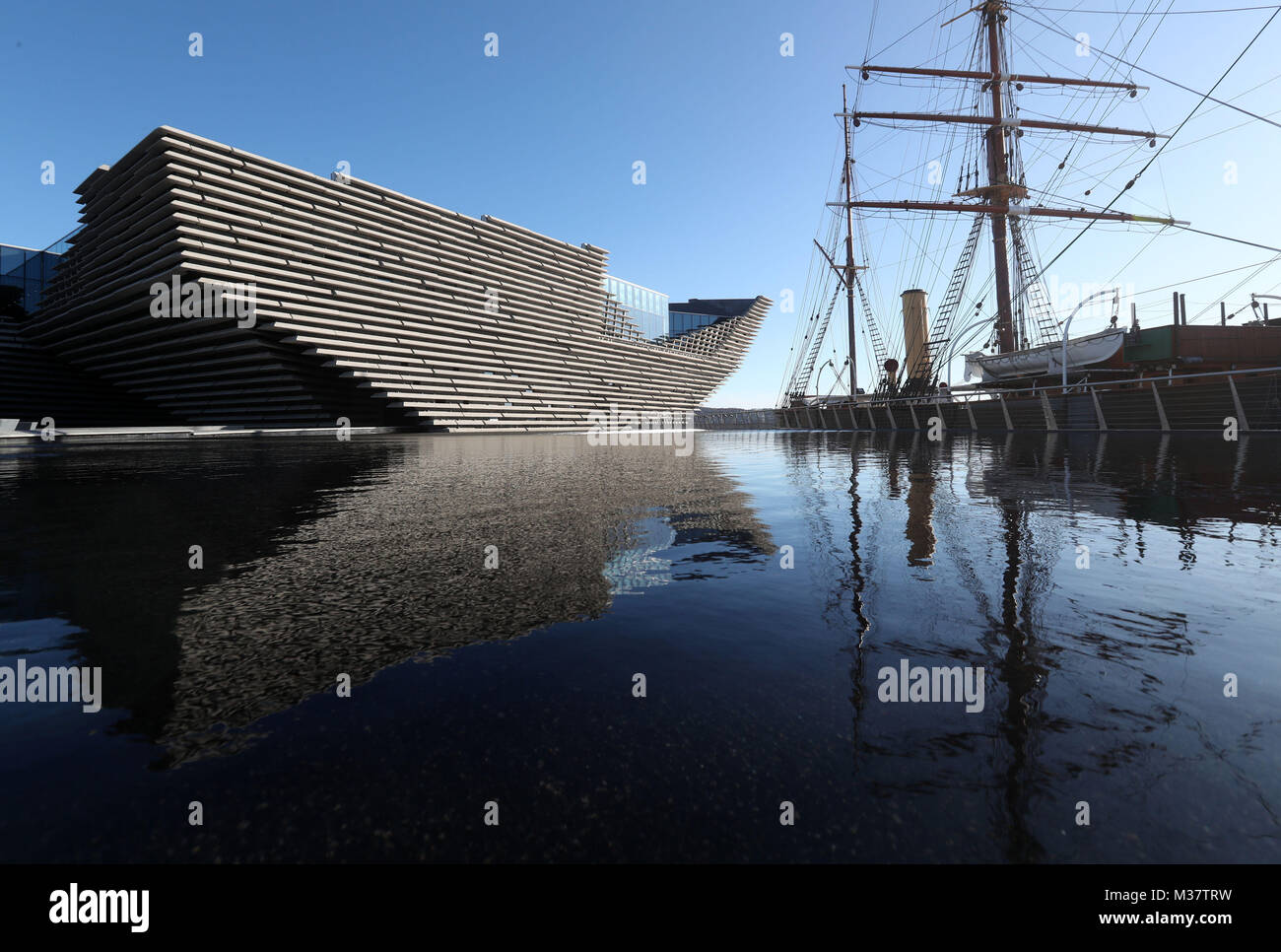A general view of the finished exterior of the new eighty million pound V&A Dundee museum as it sits next to the ship Discovery during a visit by Japanese architect Kengo Kuma(not pictured). The designer met workers as the focus moves to the interior of the V&A, fitting out gallery spaces, a cafe and a restaurant ahead of its opening in September. Stock Photo
