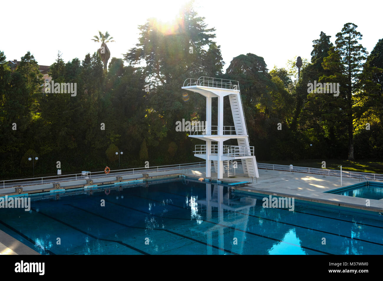 Concrete diving boards at a public outdoor swimming pool Stock Photo