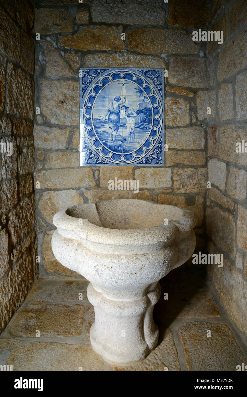 Ancient stone baptismal font at the Igreja Matriz church in Alijó, Portugal, Europe Stock Photo