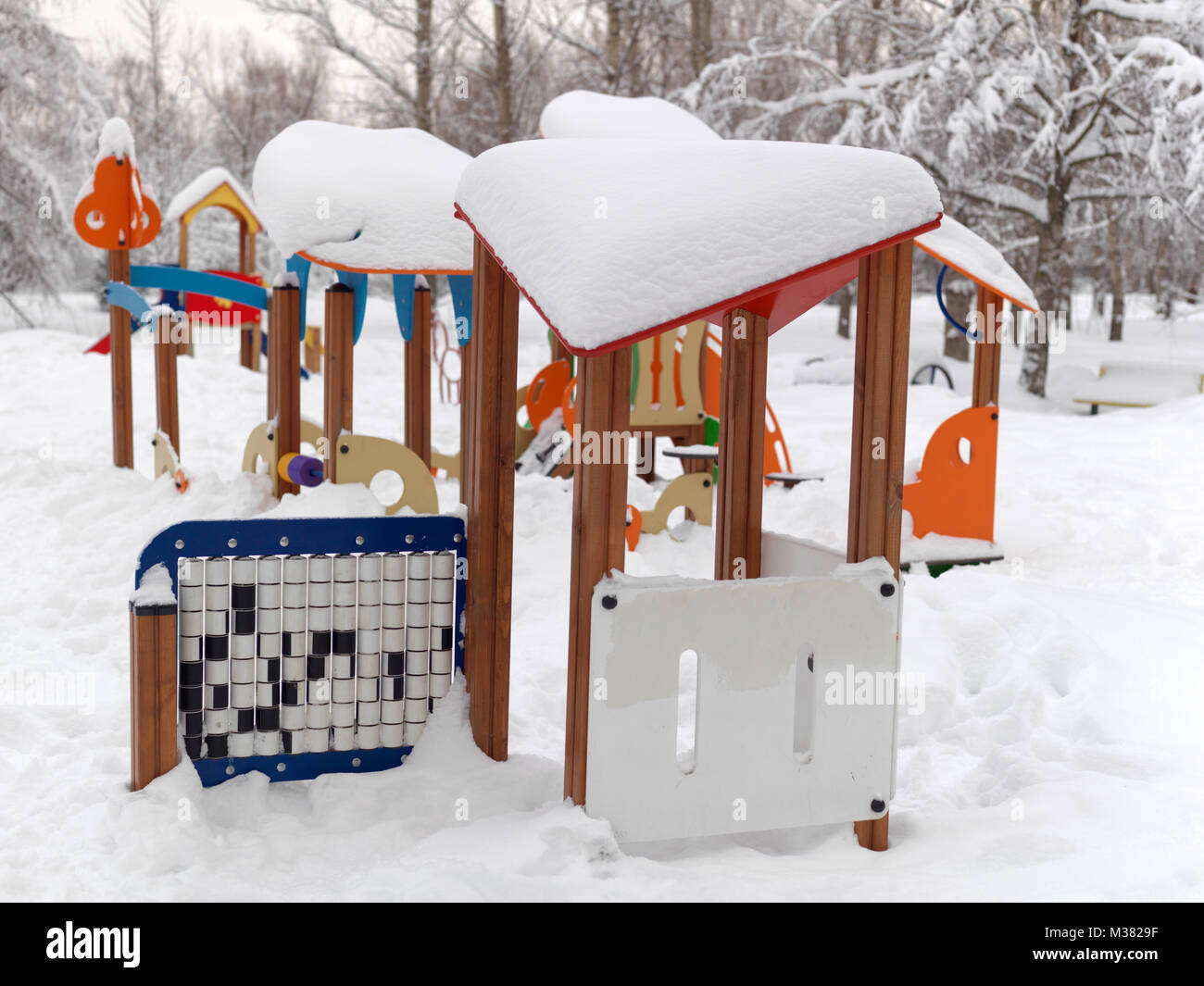 A children playground in a park covered with massive snow Stock Photo ...