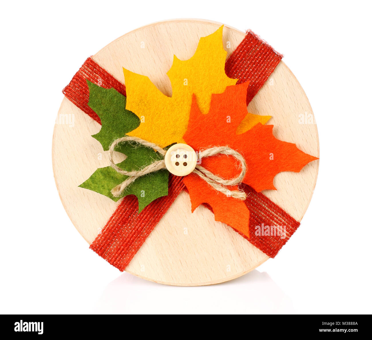 Autumn concept of present box with dried leaves on white backround Stock Photo