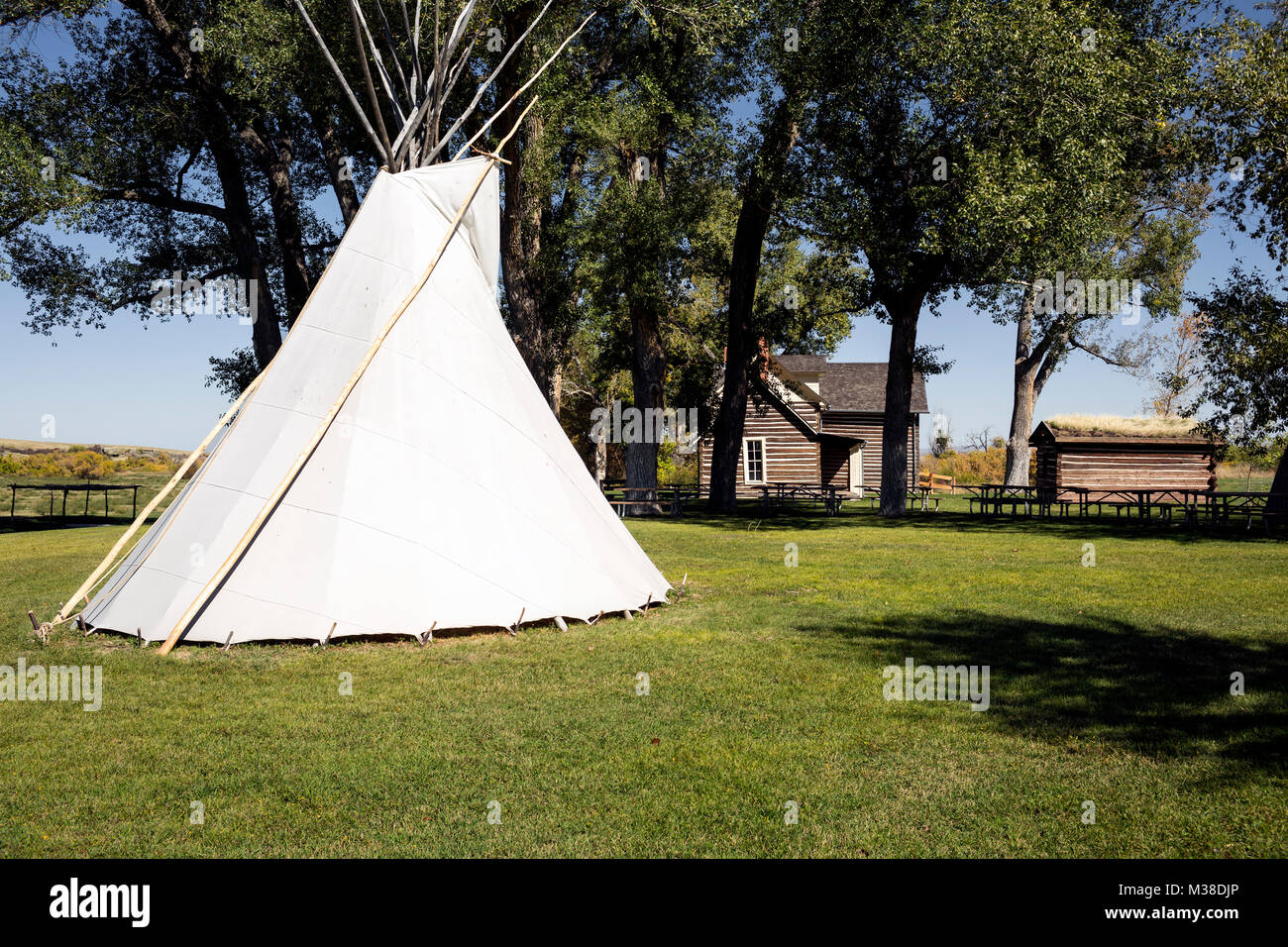 MT00102-00...MONTANA - Teepee and house at Chief Plenty Coups State Park on the Crow Indian Reservation. Stock Photo