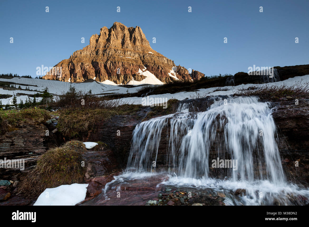 MT00130-00...MONTANA - Clements Mountain and waterfall at Logan Pass in Glacier National Park. Stock Photo