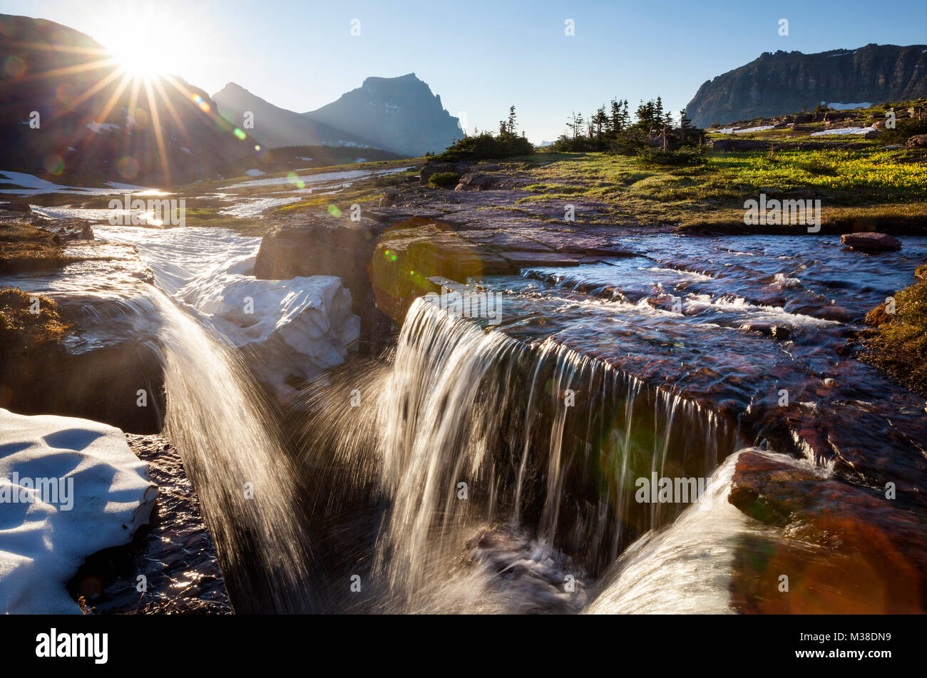 MT00132-00...MONTANA - Early season waterfalls at Logan Pass in Glacier National Park. Stock Photo