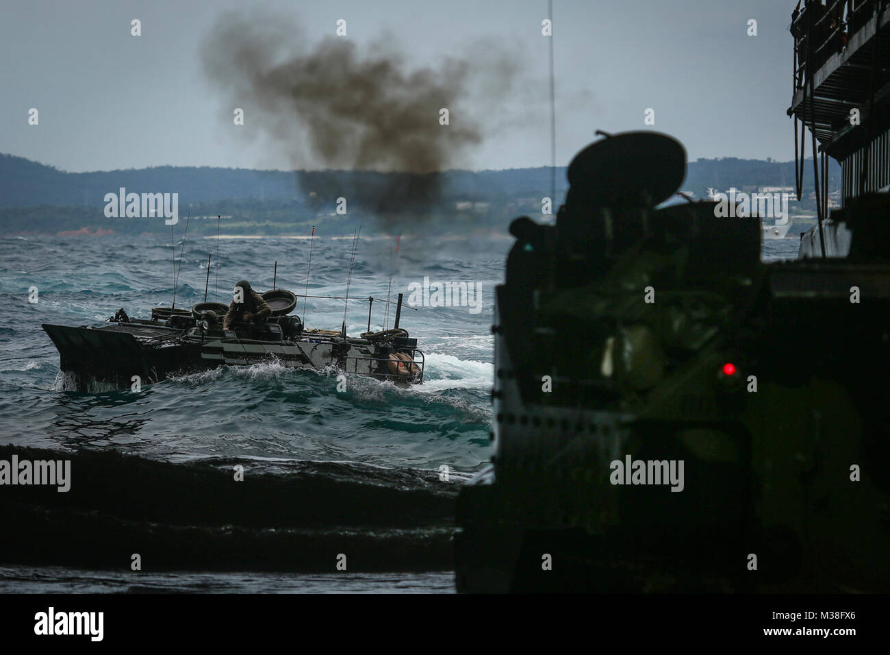 171101-M-QH615-242 PACIFIC OCEAN (Nov. 1, 2017) A U.S. Marine Corps amphibious assault vehicle (AAV) assigned to Amphibious Assault Vehicle Company, Combat Assault Battalion, prepares to embark the amphibious dock landing ship USS Ashland (LSD 48) during Blue Chromite. The annual exercise between the U.S. Navy and Marine Corps is designed to strengthen interoperability and increase naval integration and proficiencies in amphibious warfare. (U.S. Marine Corps photo by Sgt. Aaron S. Patterson/Released) U.S. Sailors, Marines train together during Exercise Blue Chromite 18 off the coast of Okinawa Stock Photo