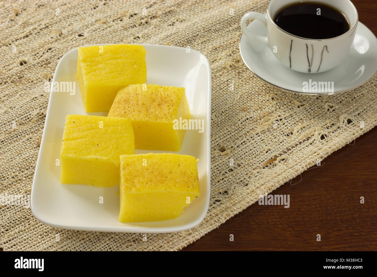 Pamonha, canjica/curau tradicional brazilian food. Tasty and delicius. Cheap street food, Eat in the breakfast or afternoon snack. made with corn Stock Photo
