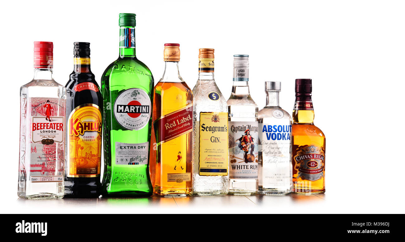 POZNAN, POLAND - DEC 15, 2017: Bottles of assorted global liquor brands including Martini, Johnnie Walker, Captain Morgan, Beefeater, Absolut Vodka, S Stock Photo
