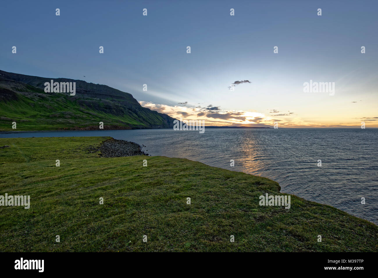 Sunset in Drangey.The island Drangey sits in the middle of Skagafjordur fjord in the north of Iceland. Stock Photo