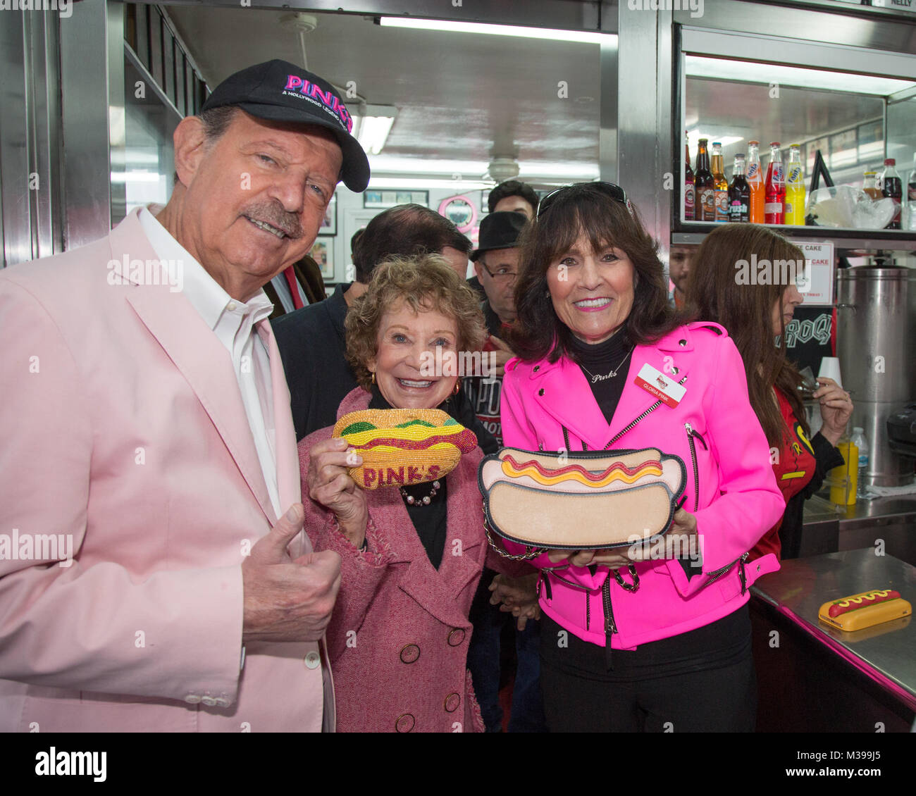 Pink's Hot Dogs honors Burt Ward, 'Robin', from 'Batman' with a hot dog named after him, the dedication was a part of the 'Batman '66' exhibit which is opening at the Hollywood Museum  Featuring: Richard Pink, Beverly Pink Wolfe, Gloria Pink Where: Los Angeles, California, United States When: 09 Jan 2018 Credit: Sheri Determan/WENN.com Stock Photo