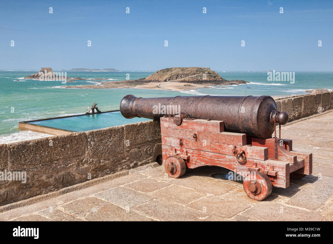Cannon looking out over the bay at Saint Malo, Brittany, France. Focus on cannon. Stock Photo